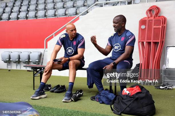 England Coaches, Paul Devlin and Chris Powell speak during an England Training Camp at FCB Campus on June 06, 2022 in Munich, Germany.