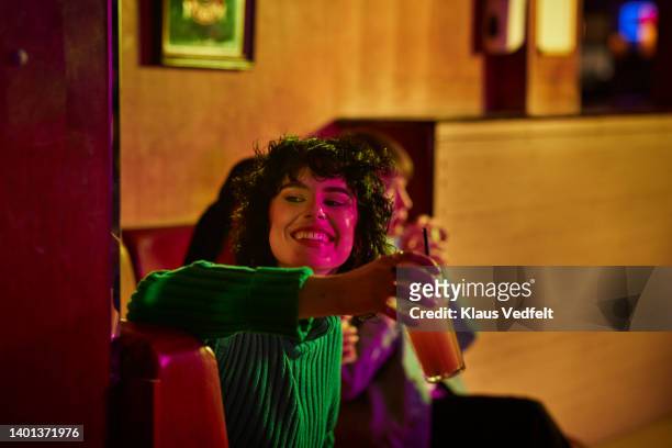 woman having drink with friends - happy hour stockfoto's en -beelden