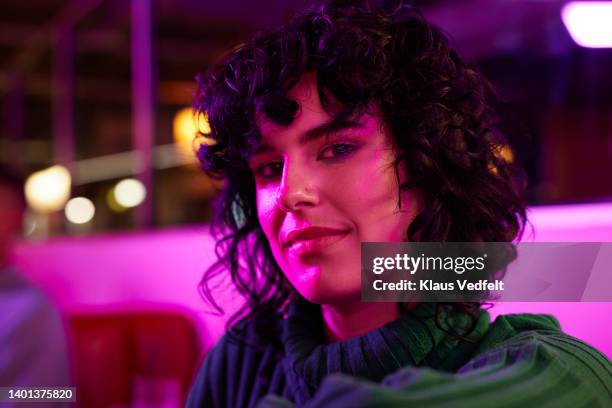 young woman at bowling alley - illuminated portrait stock pictures, royalty-free photos & images