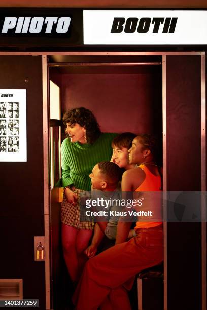 friends photographing inside photo booth - 2022 a funny thing stock pictures, royalty-free photos & images