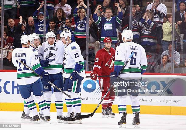 Daniel Sedin, Ryan Kesler, Henrik Sedin, Alexander Edler and Sami Salo of the Vancouver Canucks celebrate after Edler scored a first-period...