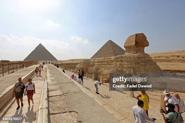 Tourists in the pyramids area on June 6, 2022 in Giza, Egypt .The pyramids, named after the Pharaohs of the period, are located in the same area as...