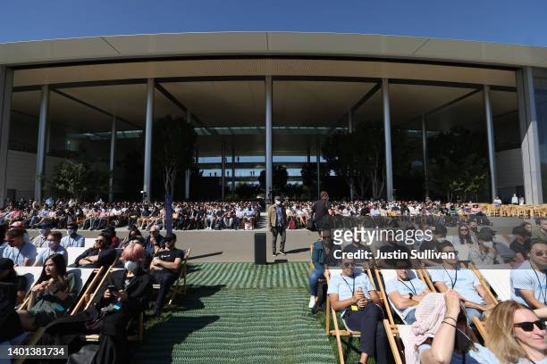 Attendees look on during the WWDC22 at Apple Park on June 06, 2022 in Cupertino, California. Apple CEO Tim Cook kicked off the annual WWDC22...