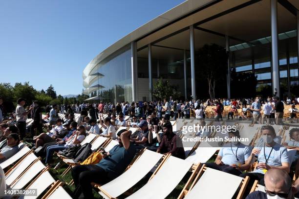 Attendees gather before the start of the WWDC22 at Apple Park on June 06, 2022 in Cupertino, California. Apple CEO Tim Cook kicked off the annual...