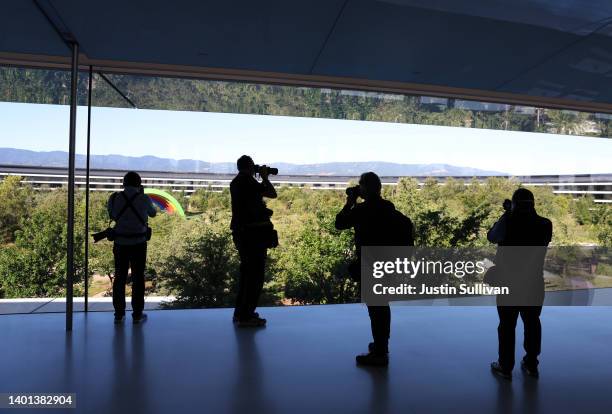 Photographers take pictures inside Apple headquarters at Apple Park on June 06, 2022 in Cupertino, California. Apple CEO Tim Cook kicked off the...