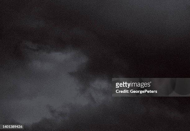 stipple illustration of spooky night cloudscape - storm clouds stock illustrations