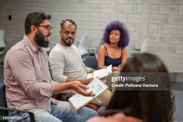 group of adults discussing business - curly purple hair stock pictures, royalty-free photos & images