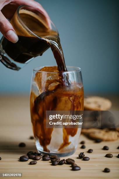 iced black coffee - iced caramel macchiato stock pictures, royalty-free photos & images