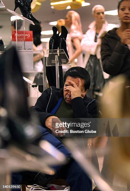 Black Friday got to Rolando Gonzales from East Boston as he had to take a rest in the women's shoe department at Macy's in Downtown Crossing, where...