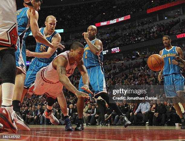 Derrick Rose of the Chicago Bulls hits the floor after being fouled by Chris Kaman of the New Orleans Hornets at the United Center on February 28,...