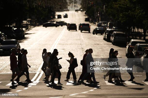 People make their way home through Kyiv to adhere to the continued 2300 curfew deadline on June 06, 2022 in Kyiv, Ukraine. A sense of normality has...