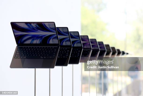 Brand new redesigned MacBook Air laptops are displayed during the WWDC22 at Apple Park on June 06, 2022 in Cupertino, California. Apple CEO Tim Cook...