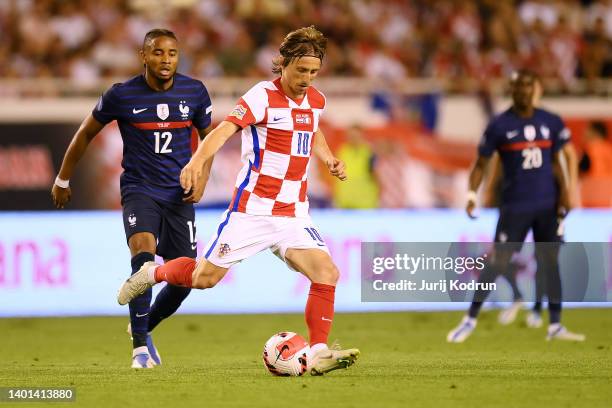 Luka Modric of Croatia controls the ball whilst under pressure from Christopher Nkunku of France during the UEFA Nations League League A Group 1...