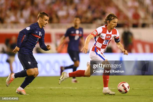 Luka Modric of Croatia runs with the ball whilst under pressure from Antoine Griezmann of France during the UEFA Nations League League A Group 1...