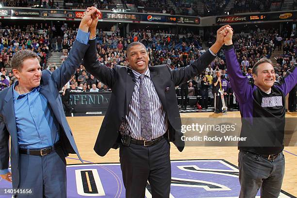 Sacramento Kings owners Joe Maloof, left, and Gavin Maloof, right, celebrate with Sacramento Mayor Kevin Johnson during a game against the Utah Jazz...