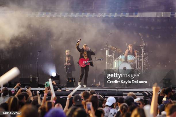 Michael Clifford, Luke Hemmings, and Ashton Irwin of 5 Seconds of Summer performs at the iHeartRadio Wango Tango concert at Dignity Health Sports...