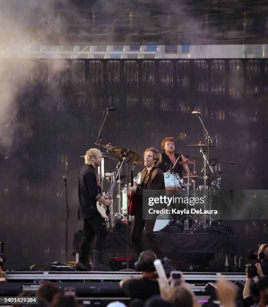 Michael Clifford, Luke Hemmings, and Ashton Irwin of 5 Seconds of Summer performs at the iHeartRadio Wango Tango concert at Dignity Health Sports...