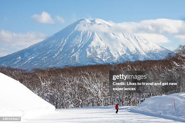 snow covered mountain - mount yotei stock pictures, royalty-free photos & images