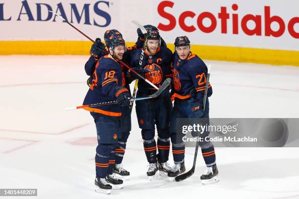 Connor McDavid of the Edmonton Oilers celebrates with teammates after scoring a goal against the Colorado Avalanche during the second period in Game...