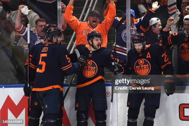 Zach Hyman of the Edmonton Oilers celebrates with teammates after scoring a goal against the Colorado Avalanche during the second period in Game Four...