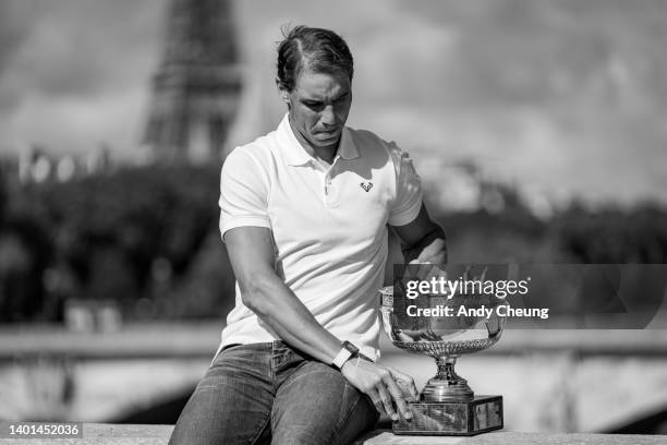 Rafael Nadal of Spain poses with the Musketeers Cup at the photocall after winning his 14th Roland Garros Grand Chelem title at Pont Alexandre III...