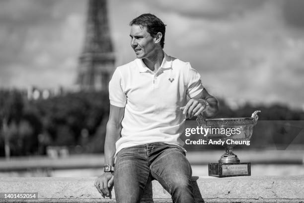 Rafael Nadal of Spain poses with the Musketeers Cup at the photocall after winning his 14th Roland Garros Grand Chelem title at Pont Alexandre III...