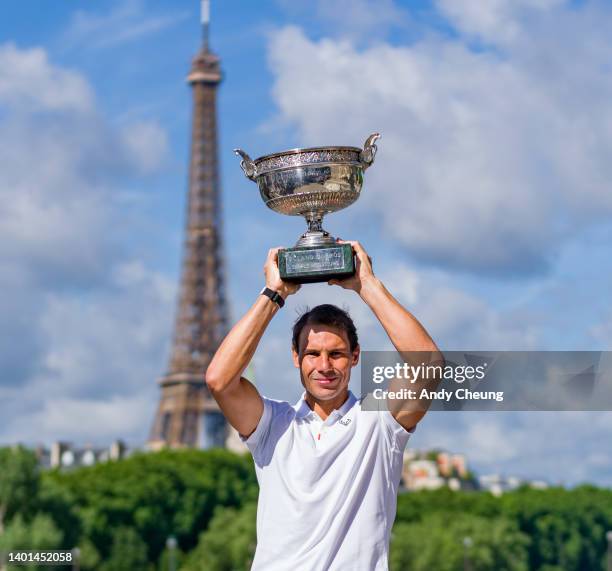 Rafael Nadal of Spain poses with the Musketeers Cup at the photocall after winning his 14th Roland Garros Grand Chelem title on Pont Alexandre III...