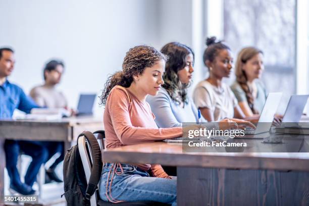 university students in class - financial literacy stock pictures, royalty-free photos & images