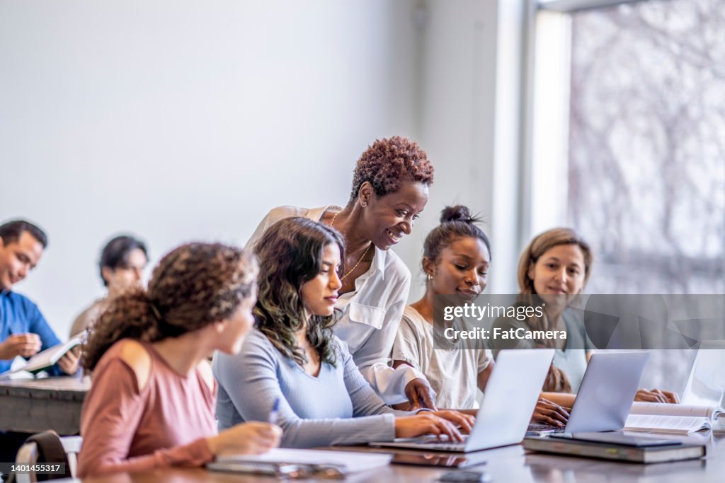 Professor Helping University Students