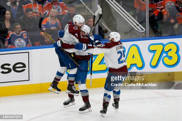 Artturi Lehkonen of the Colorado Avalanche celebrates with Devon Toews and Logan O'Connor after scoring the game winning goal in overtime to defeat...