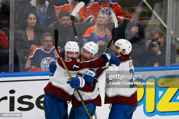 Artturi Lehkonen of the Colorado Avalanche celebrates with Devon Toews and Logan O'Connor after scoring the game winning goal in overtime to defeat...