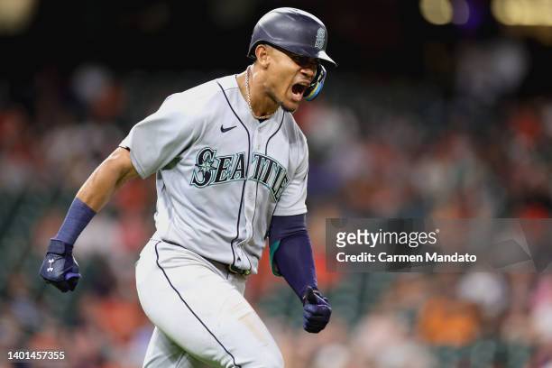 Julio Rodriguez of the Seattle Mariners reacts to hitting a two ruhn home run during the ninth inning against the Houston Astros at Minute Maid Park...