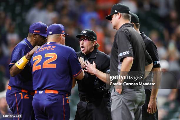 Omar Lopez of the Houston Astros is sent off the field during the ninth inning by umpire Chris Guccione at Minute Maid Park on June 06, 2022 in...