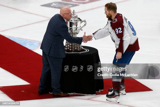 Gabriel Landeskog of the Colorado Avalanche shakes hands with Deputy Commissioner Bill Daly before the presentation of the Clarence S. Campbell Bowl...