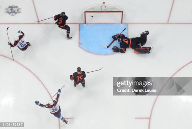 Artturi Lehkonen of the Colorado Avalanche celebrates after scoring the game winning goal against Mike Smith of the Edmonton Oilers in overtime in...