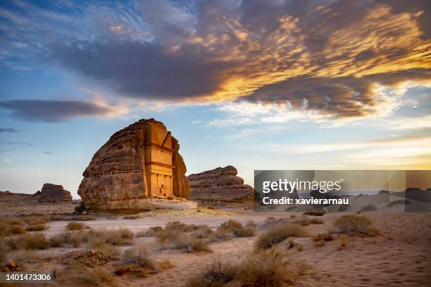 sunset portrait of tomb of lihyan, son of kuza, in hegra - romantic sky stock pictures, royalty-free photos & images