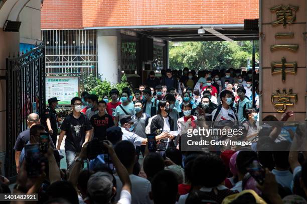 Students leave the examination room after finishing the first Chinese national college entrance exam on June 7, 2022 in Wuhan, Hubei province, China....
