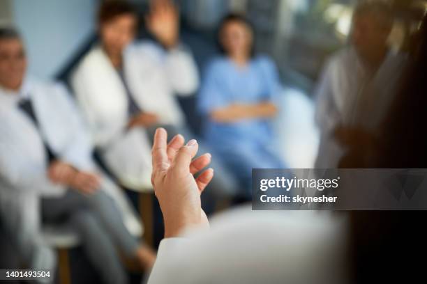 close up of giving a speech on a seminar in the hospital. - doctor speech stock pictures, royalty-free photos & images