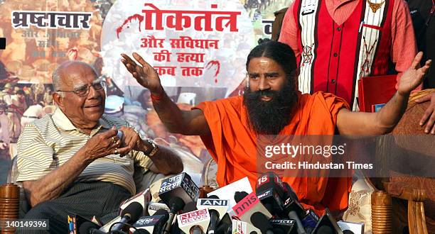 Yoga guru Baba Ramdev and Senior Advocate Ram Jethmalani address press conference after Supreme Court Verdict on Ramlila Maidan lathi Charge case at...