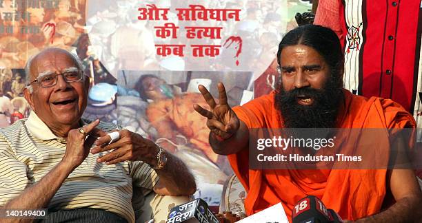 Yoga guru Baba Ramdev and Senior Advocate Ram Jethmalani address press conference after Supreme Court Verdict on Ramlila Maidan lathi Charge case at...