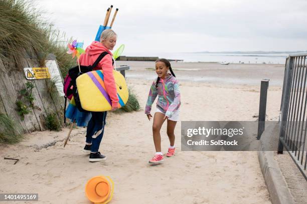 a beach holiday - beach shelter stockfoto's en -beelden