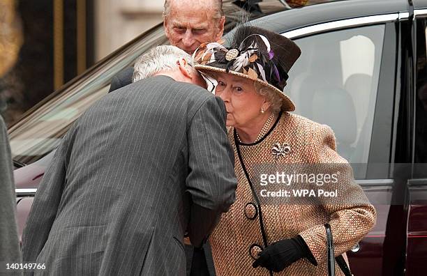 Queen Elizabeth II kisses her cousin Prince Richard, Duke of Gloucester as she and Prince Philip, Duke of Edinburgh arrive at the central gates of...