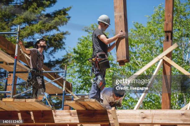 men building and eco house - construction worker stock pictures, royalty-free photos & images