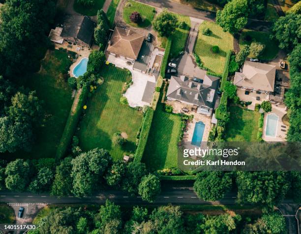 an aerial view of suburban houses in surrey, uk - surrey england stock pictures, royalty-free photos & images