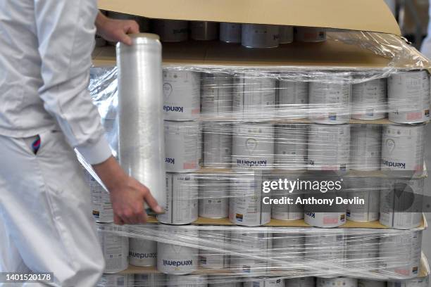 Employeed shrink wrap a pallet of Kendamil Classic First baby formula at Kendal Nutricare, the baby-formula producer on June 07, 2022 in Kendal,...