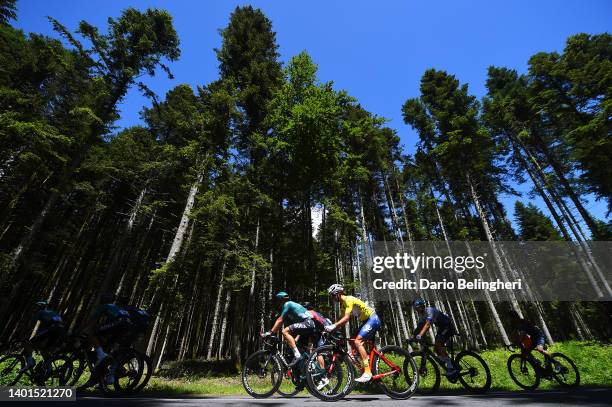 Alexis Vuillermoz of France and Team Total Energies Yellow Leader Jersey and the peloton passing through a wooded area during the 74th Criterium du...