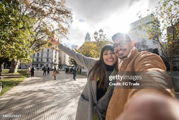 selfie of a happy young couple exploring the city - buenos aires travel stock pictures, royalty-free photos & images