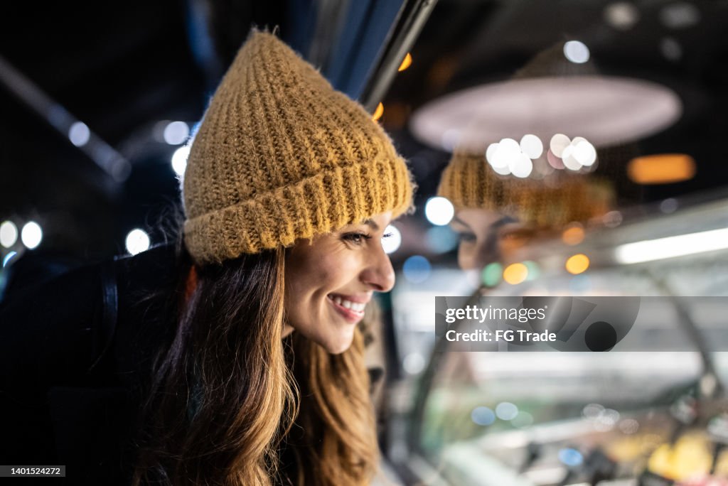 Young woman looking at ice cream counter