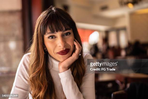 portrait of a young woman in a cafeteria - no confidence stock pictures, royalty-free photos & images