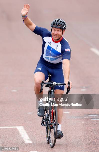 Sir Chris Hoy rides his bicycle down The Mall during the Platinum Pageant on June 5, 2022 in London, England. The Platinum Jubilee of Elizabeth II is...